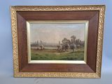 une vieille photo représentant un tableau représentant un paysage, dans un cadre doré