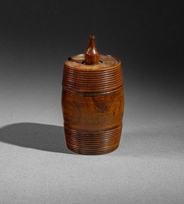 an old wooden container with a wooden lid on a table