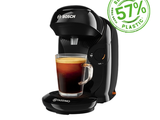 La machine à café Neso est exposée, avec une tasse de café posée devant elle.