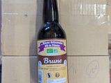a bottle of beer sitting on top of a cardboard box