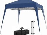 a blue tent with two poles and a bag underneath it