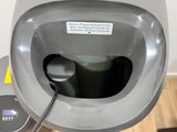 a close up of a urinal in a public restroom