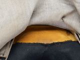 a close up of a person ' s pants with a banana in the pocket