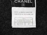 chanel label on a black and white sweater