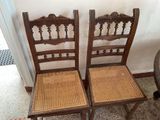 two chairs that are sitting next to each other