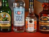 several bottles of alcohol are lined up on a table