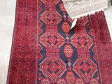 an image of a red and blue rug on the floor