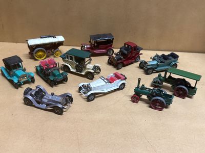 a lot of toy cars that are sitting on a table