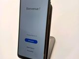 the back view of a smartphone with the screen open and the text bienvenue on the screen