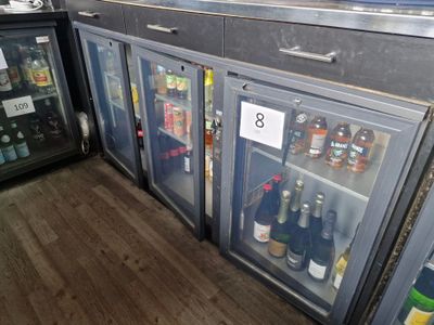 many bottles of alcohol in the fridges in the kitchen
