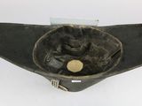 a black hat with a gold coin inside of it