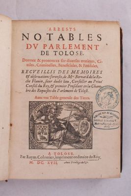 un livre ouvert sur lequel figure l'image d'un homme à cheval