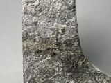 close up of a large rock on a gray surface