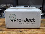 a box of project audio systems sitting on top of a wooden table