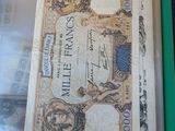 a picture of an old bank note in a green folder