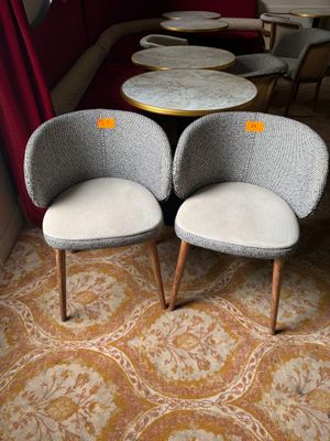 two chairs and a table in the corner of a room
