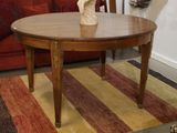a table with a vase on top of it in a living room