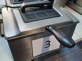 an image of a commercial deep fryer in a kitchen