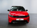 the red car is parked in the showroom of the showroom