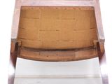 a wooden chair with a green upholstered seat