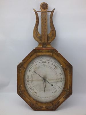 a clock that is sitting on a white surface