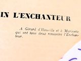 a close up of a book with a piece of paper on it