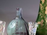three glass vases sitting next to each other on a table
