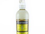 a bottle of chartreuse lemon liqueur on a white background