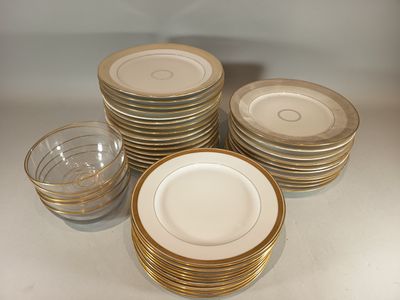 a lot of plates and glasses on the table