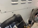 a close up of a machine with a hose attached to it