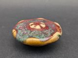 a picture of a stone with a flower design on it