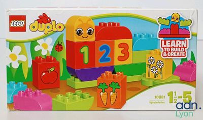 a box of lego duplo toys with a picture of a train and carrots