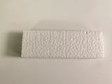 a piece of white paper on a white surface