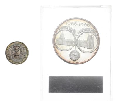 a coin with a picture of a couple of people on it
