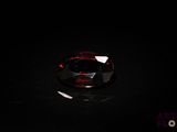 gros plan d'un diamant rouge sur une surface noire