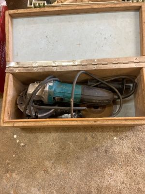 a box that has a drill in it on the floor