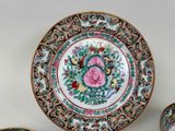 a plate and two cups sitting on a table