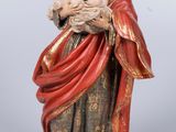 a statue of a man holding a baby in his arms