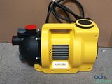 the yellow blower is sitting on the floor next to a cardboard box