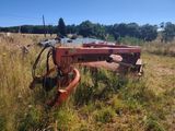 an image of an old farm equipment in a field