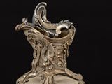 an antique silver vase on a black background with a black background