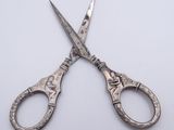 a pair of scissors that are sitting on a table