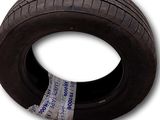 a close up of a tire on a white surface