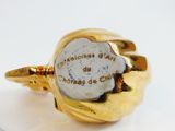 an image of a gold ring with a stone in the center