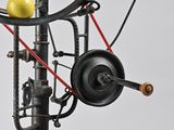 an image of a model of a spinning machine with a yellow apple on top of it