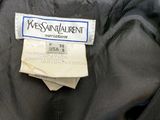 an image of a label on a black jacket that says west saint laurent