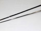 pair of swords on a white surface with a black handle