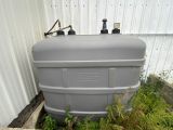 an image of a water tank in the grass