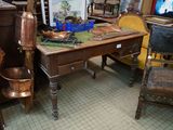 a desk with a chair and a picture on it