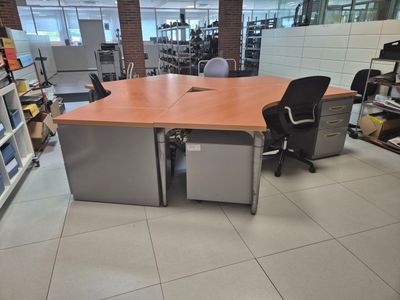 a desk with a chair in the middle of a room